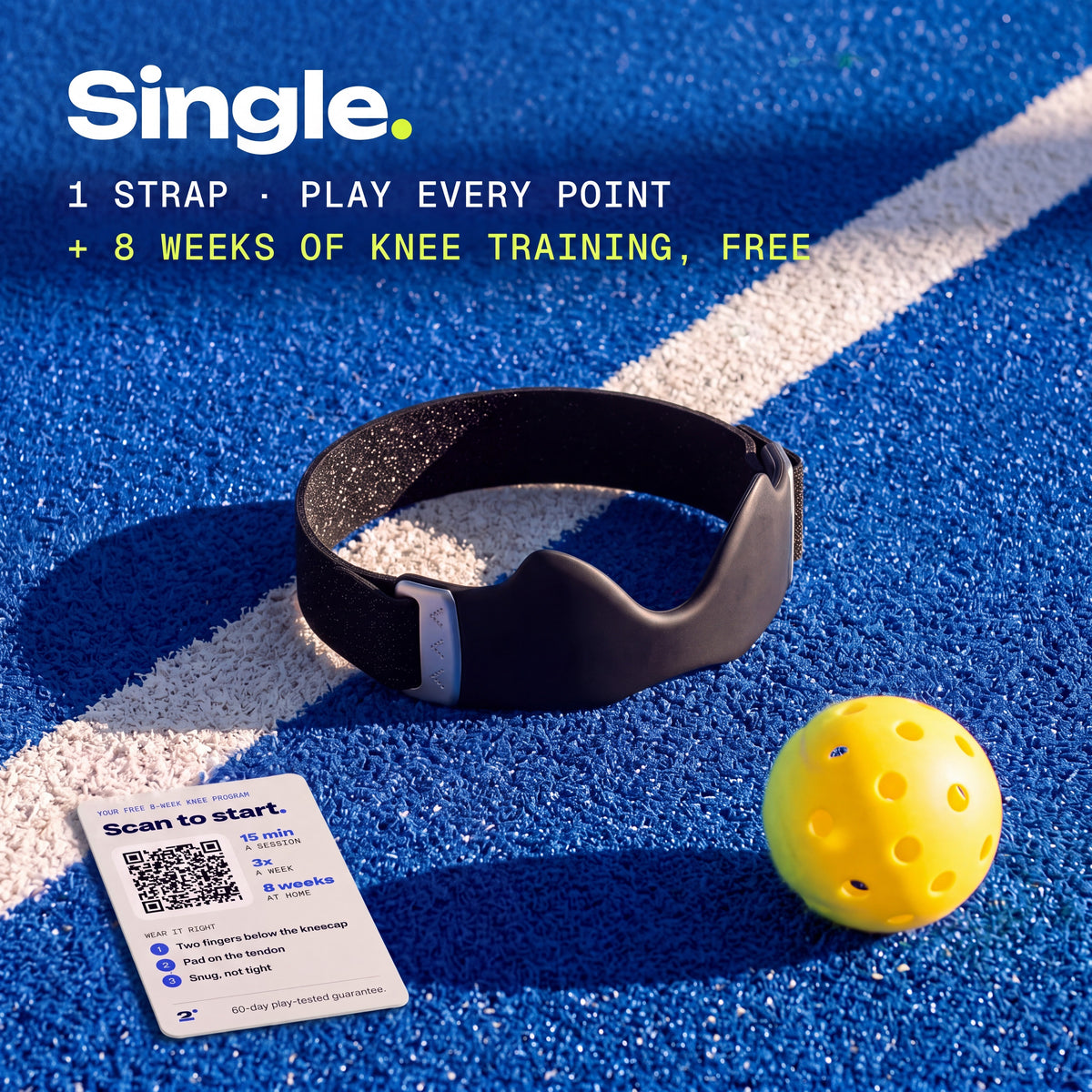 One Ink Second Set strap on a pickleball court, with the free 8-week knee training card