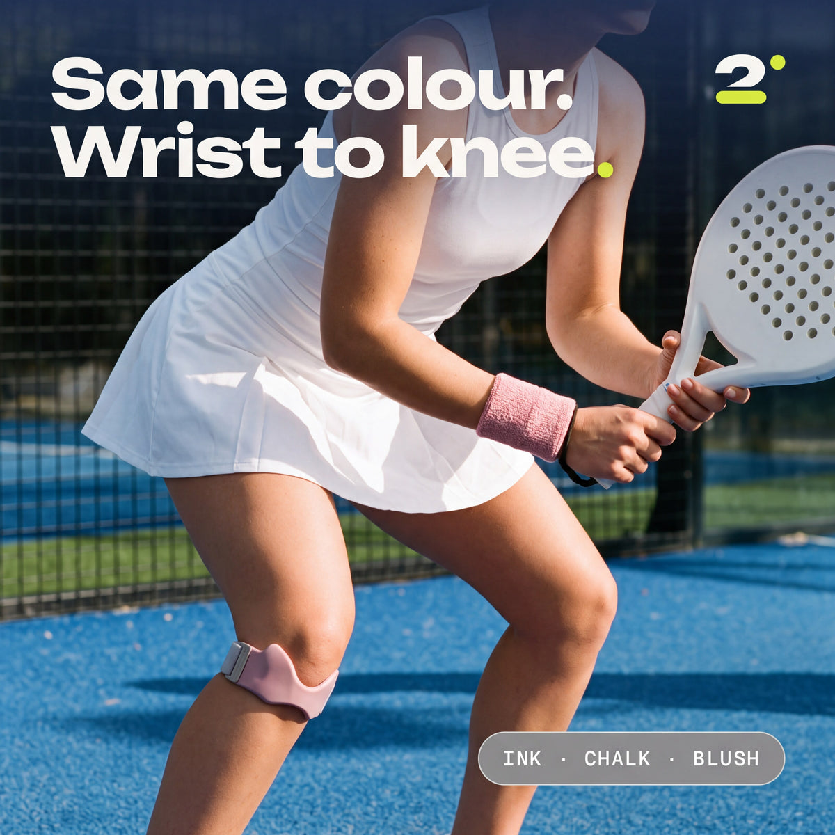 A player in a Blush sweatband and a Blush Second Set strap on court. Same colour. Wrist to knee.